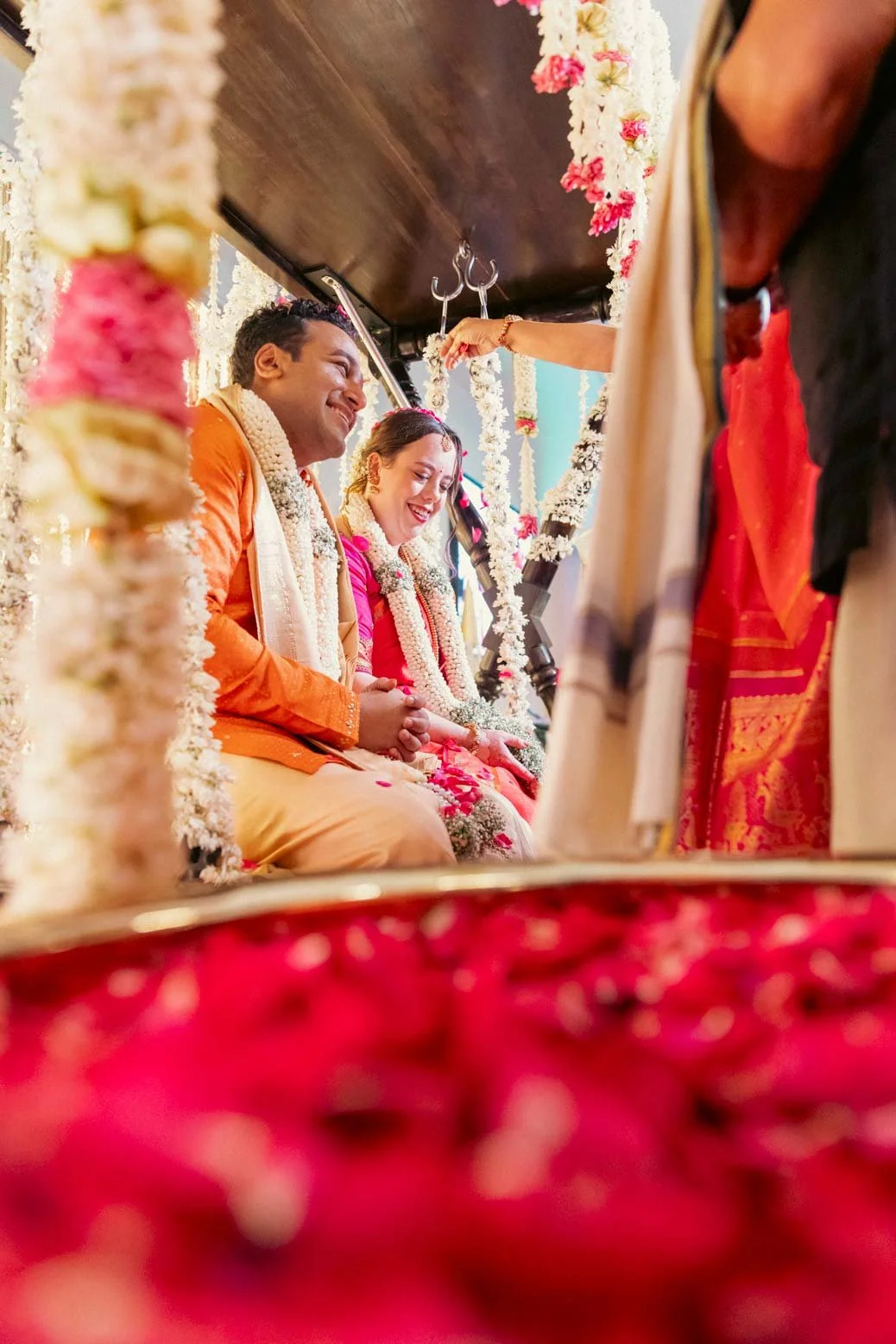 DESCRIPTION
Candid moment as guest greets and blesses groom and bride in traditional oonjal ceremony in Indian Wedding
