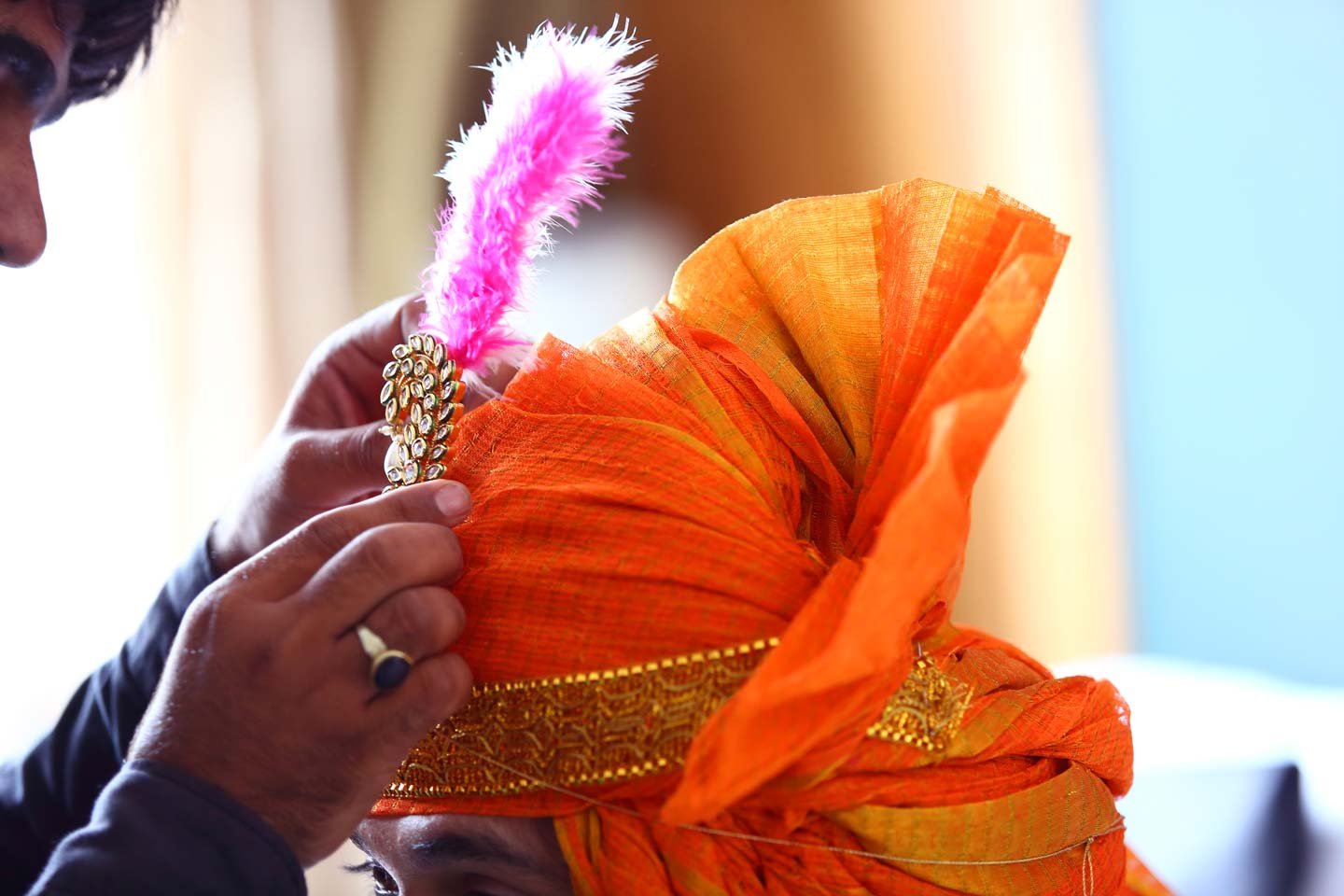 Close up of a feather and ornaments for the turban of a north indian groom