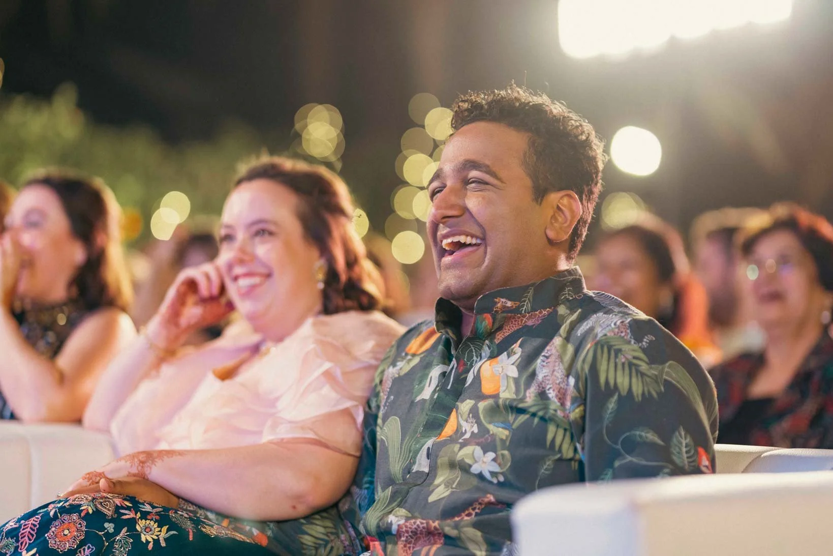Groom and bride laugh out loud during Sangeeth dance performance at Indian Wedding