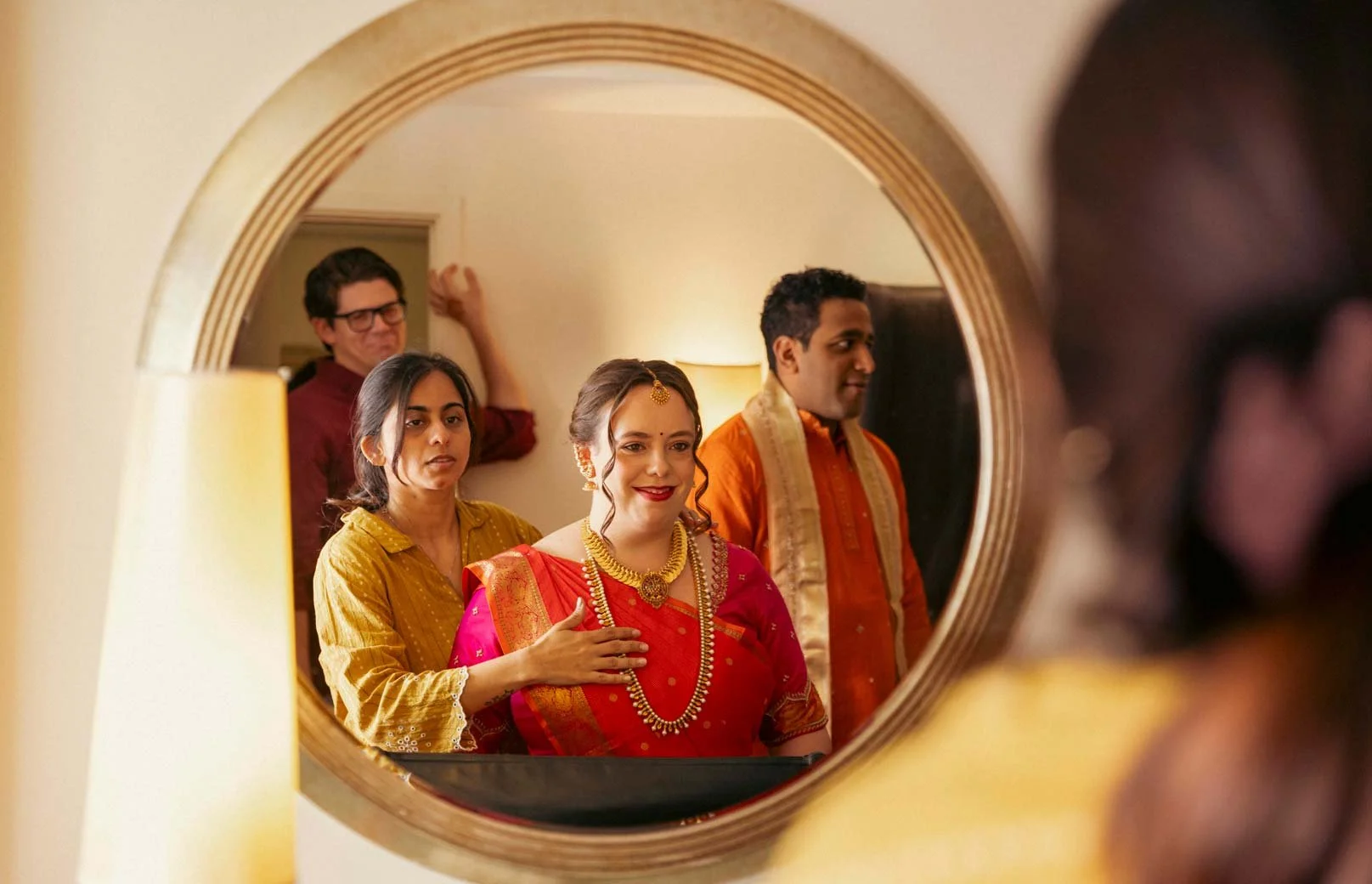 American bride gets ready  as the make up artist works on her for her  traditional South Indian wedding ceremony