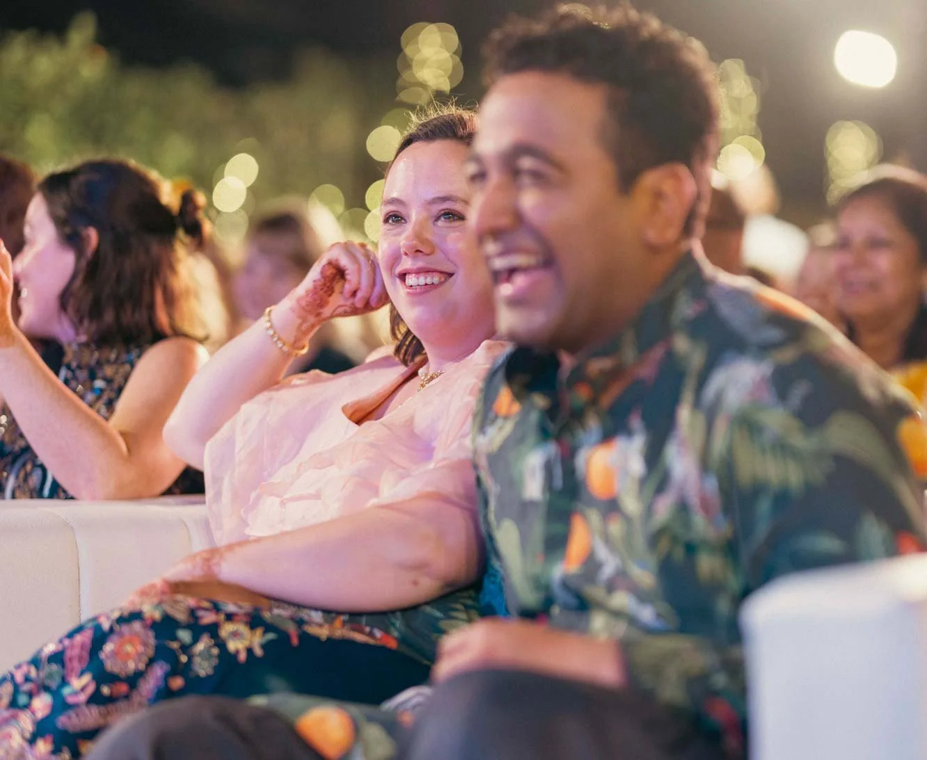 Groom and bride laugh out loud during Sangeeth dance performance at Indian Wedding