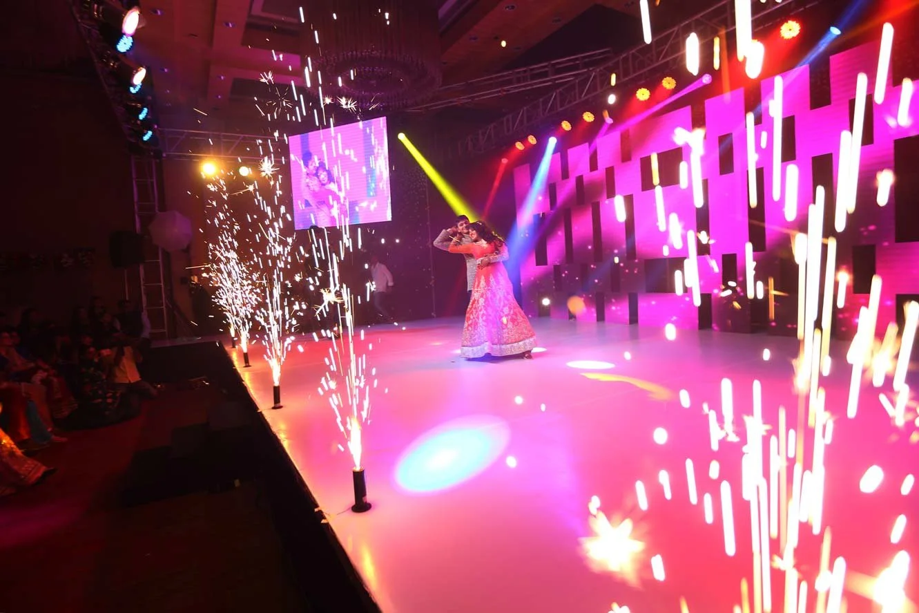 Sangeeth couple dance moment with fireworks in the foreground