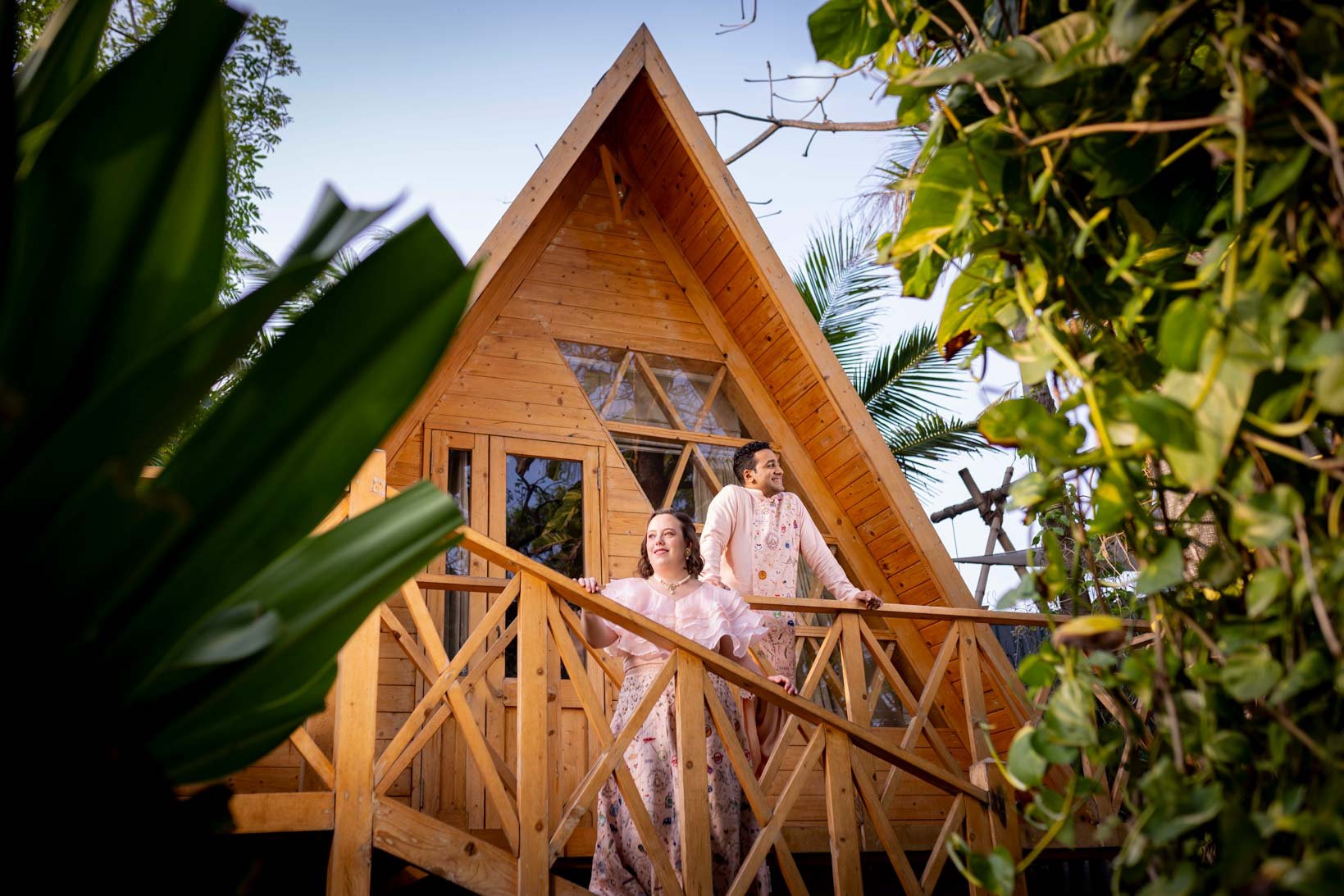 Classic Portrait of a couple against a wooden house background 
