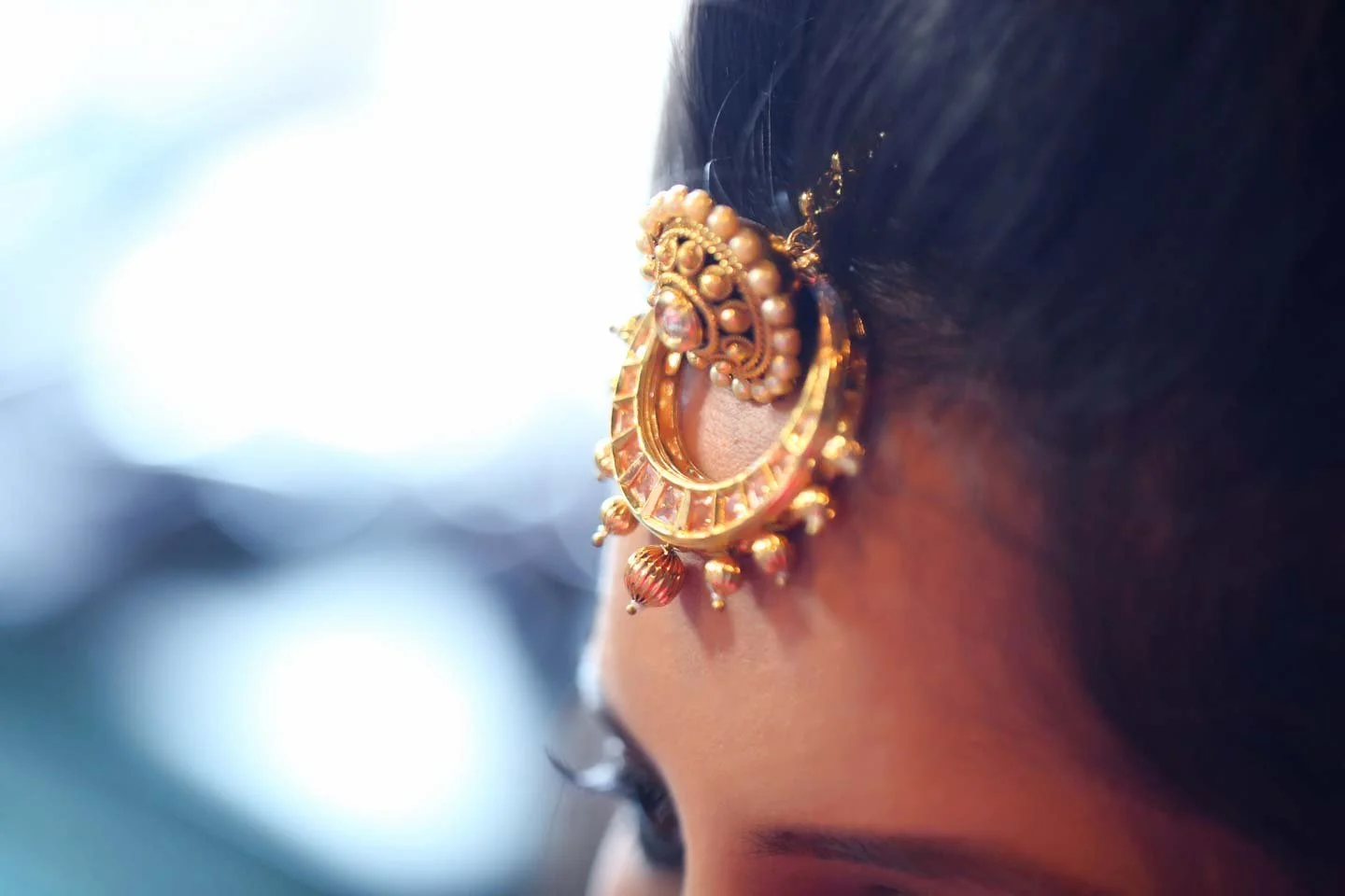Close up of traditional indian brides head jewellery