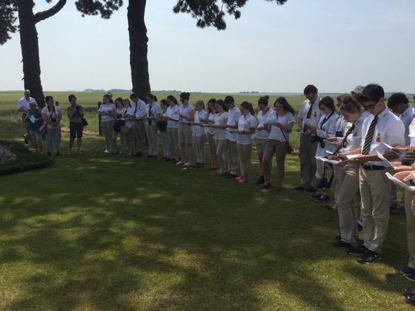 Students read aloud the names of the fallen at Gueudecourt