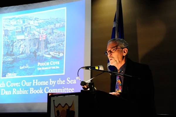 Mr. Dan Rubin accepts the award on behalf of the Pouch Cove Heritage Society and the book committee who worked on "Pouch Cove: Our Home by the Sea".