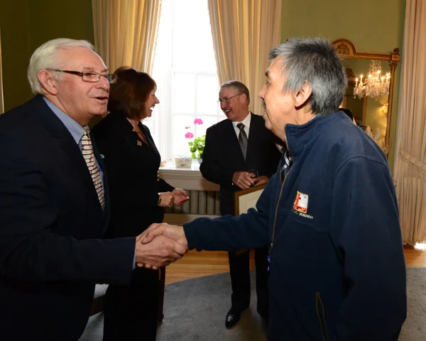 Mr. Levi Nochasak, heritage carpenter who worked on the Hebron Mission restoration, meets His Honour, The Honourable Frank F. Fagan at the post-award reception at Government House.