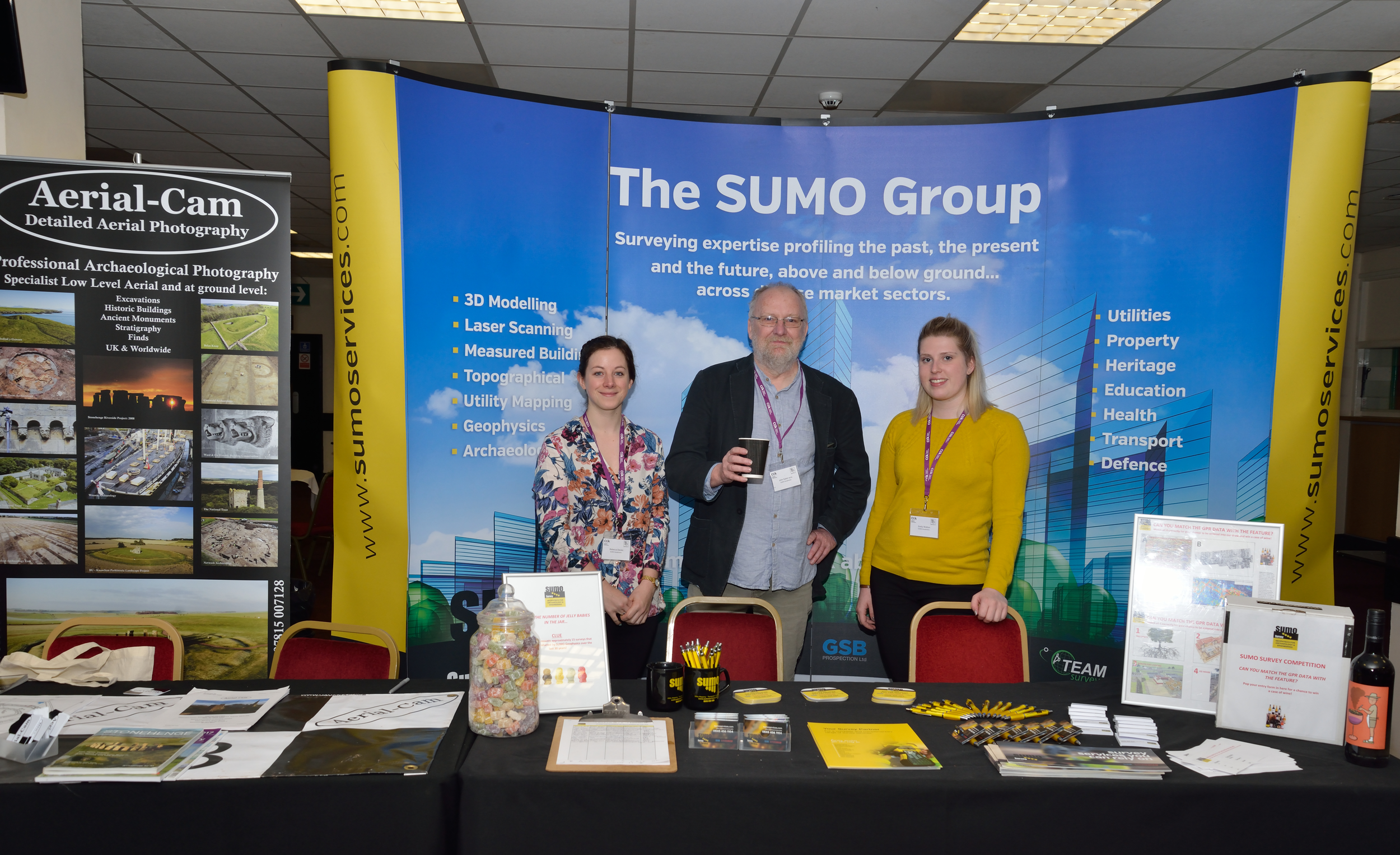 The SUMO Geophysics team ready at their stand. Left to right: Becky Davies, Dr John Gater, Emily Walton.