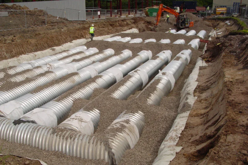 The image shows buried attenuation tanks.