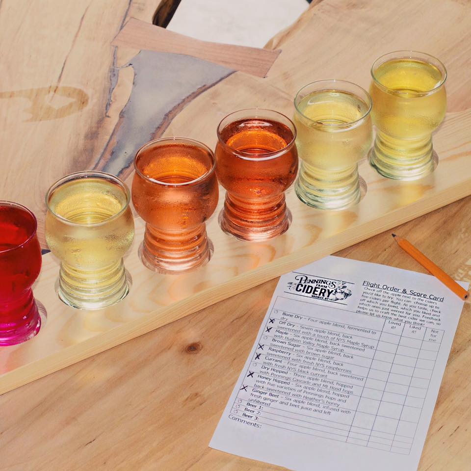 Picture of cidery flight with scorecard