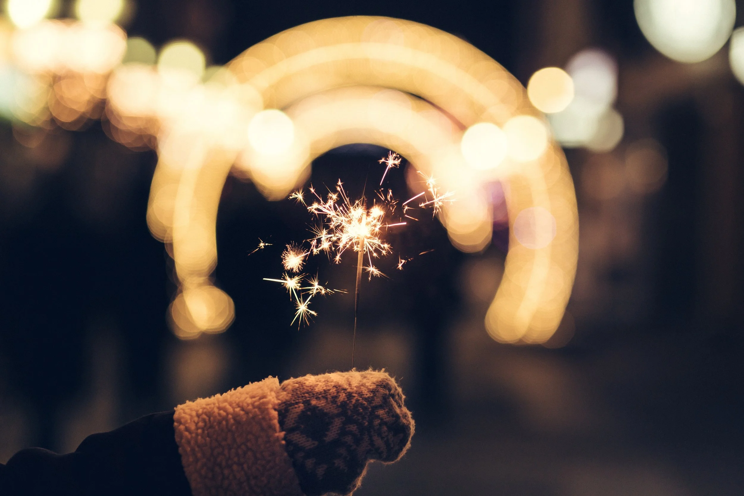negative-space-celebration-hand-sparkler-fireworks-lights-night-freestocks.jpg