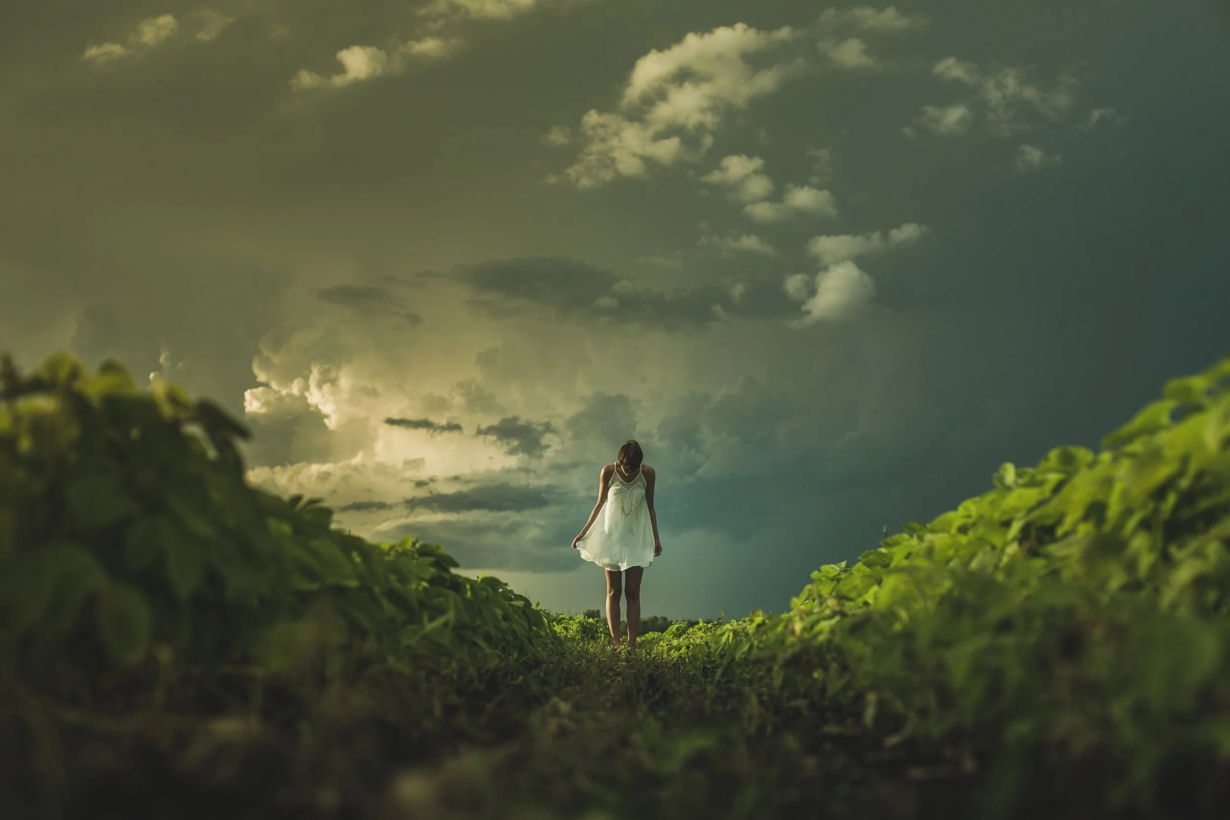 negative-space-woman-white-dress-field-clouds-matthew-henry.jpg