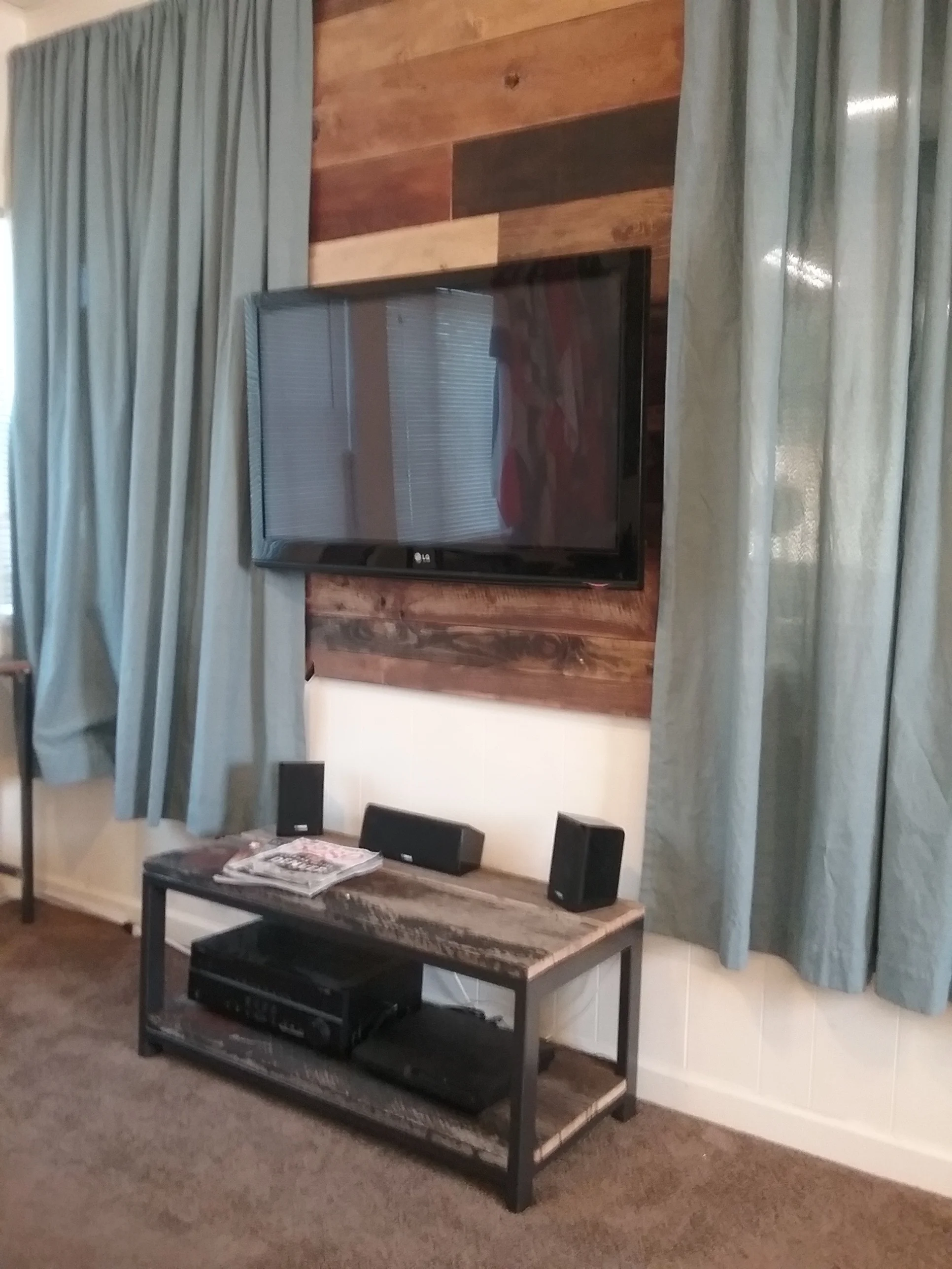 Reclaimed accent wall and Entertainment stand