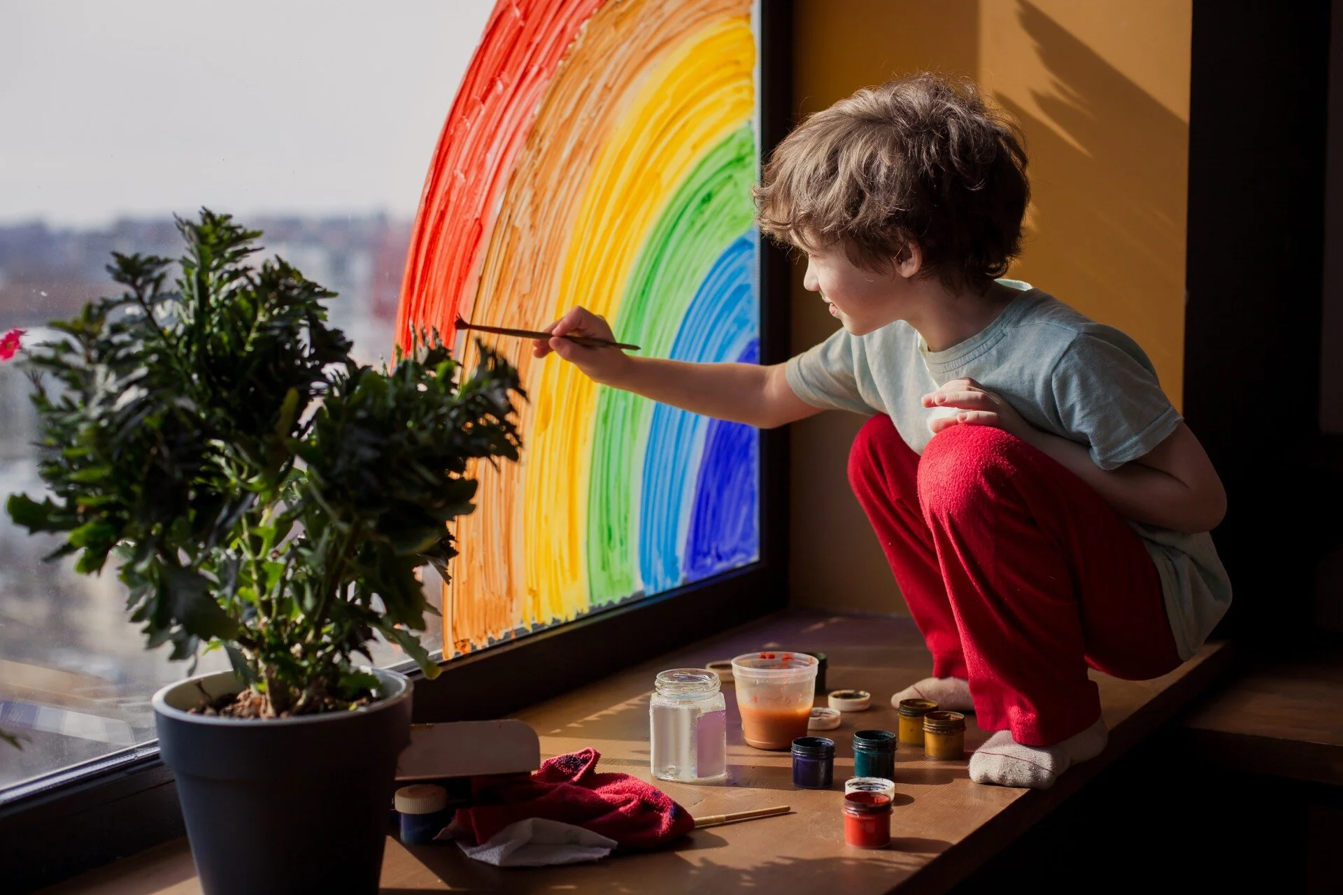 child painting rainbow.jpg