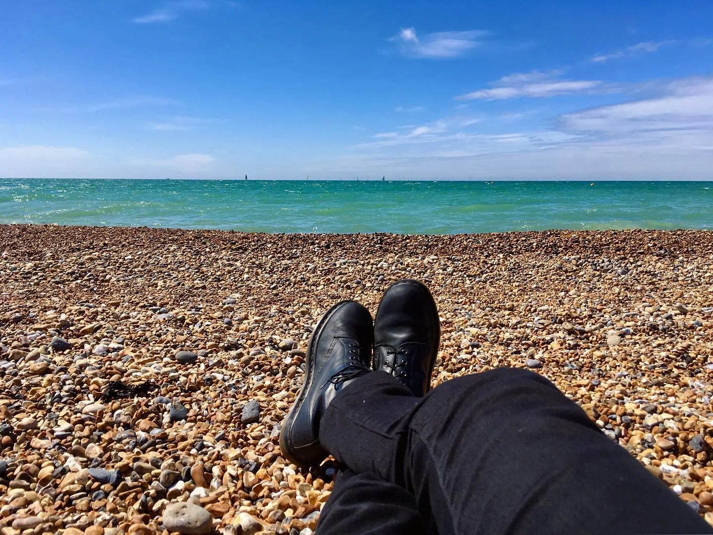 Working on my tan at the beach in Brighton.