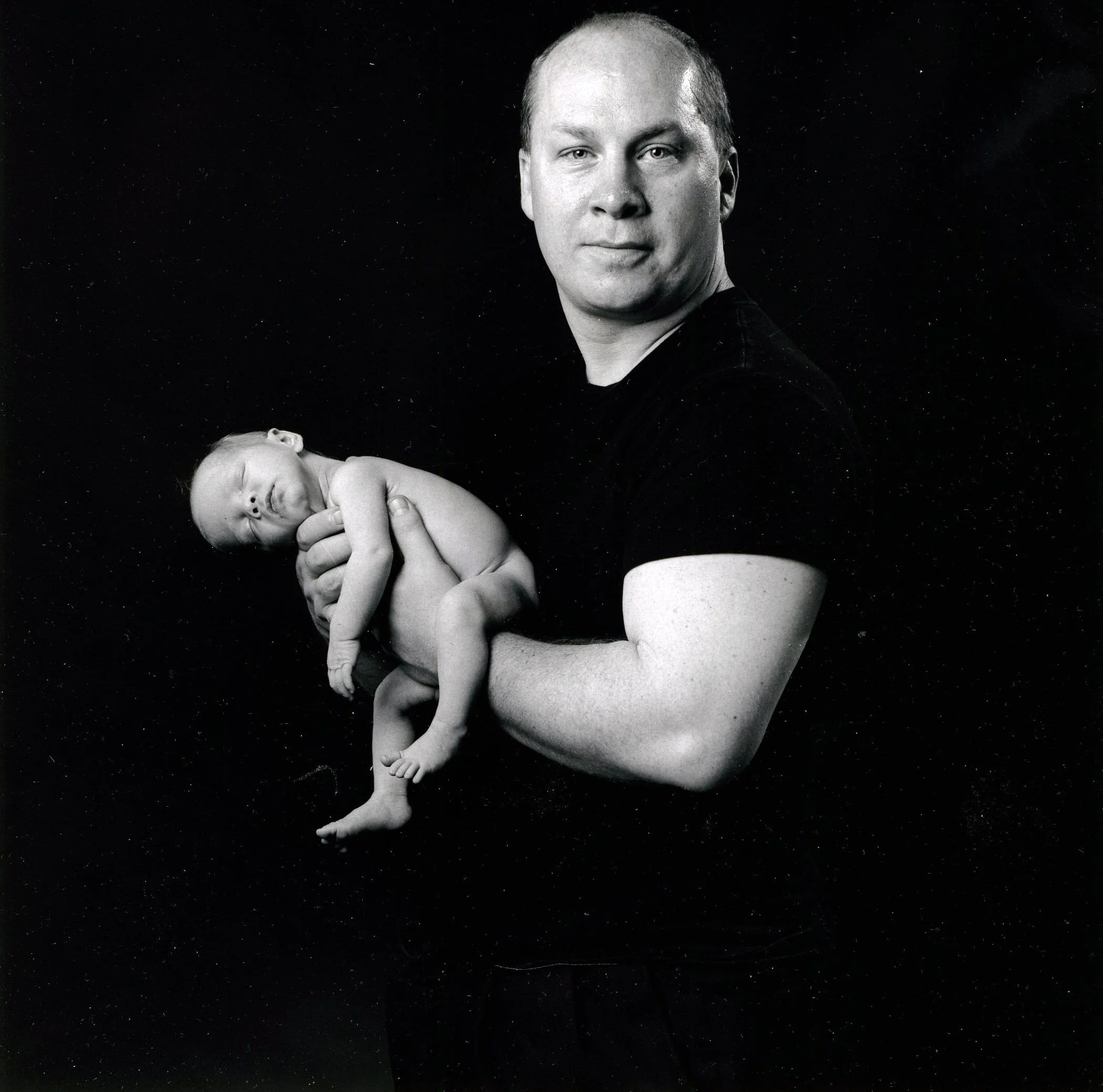 Father with newborn infant