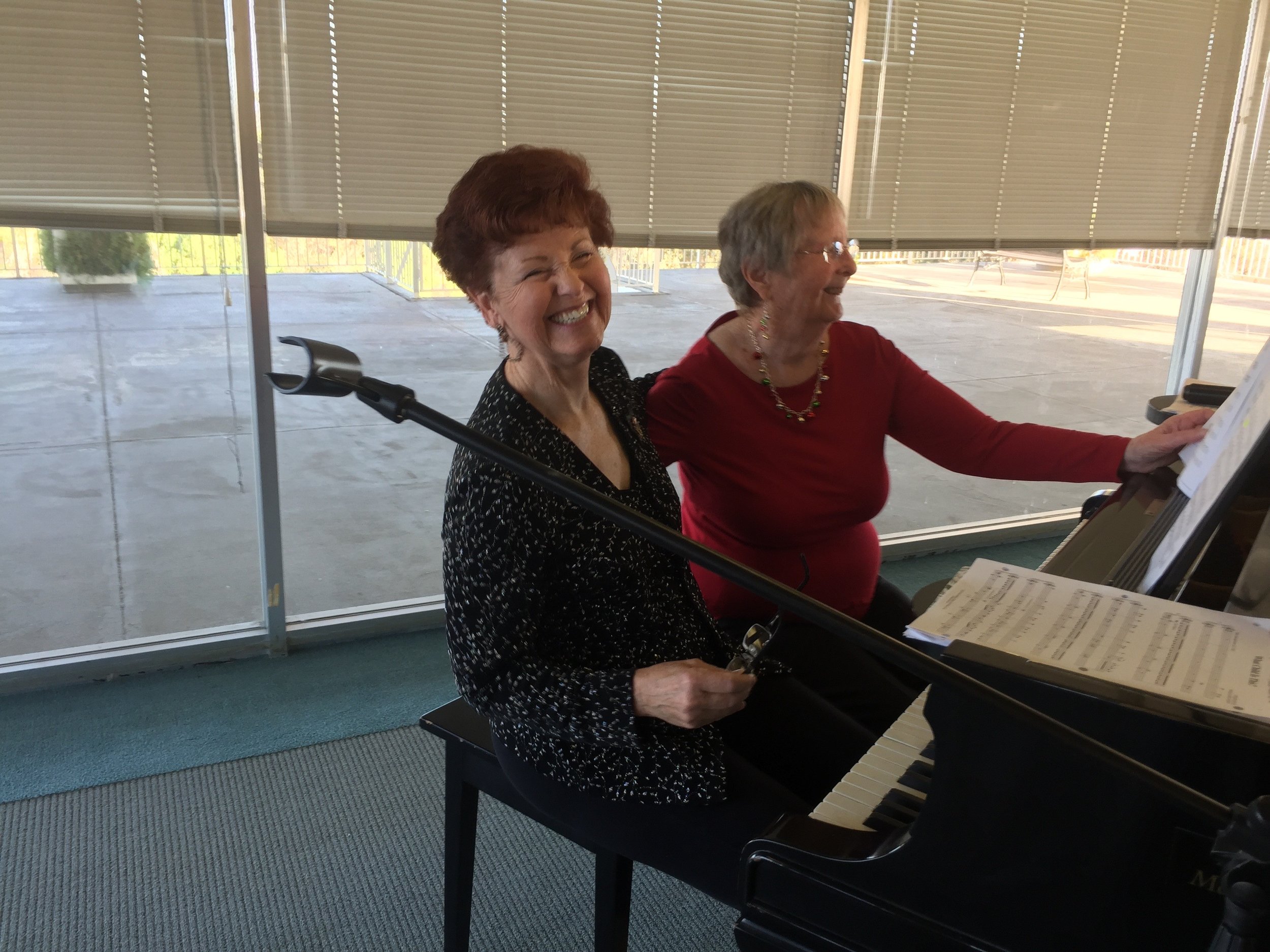 Fern Fay playing piano at Holiday Meeting