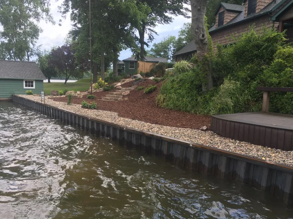 New steel seawall with landscaping on Hamlin Lake