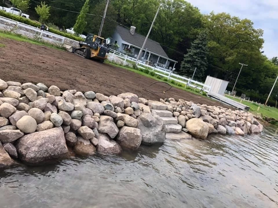  Natural rock shoreline protection with stone steps to water 