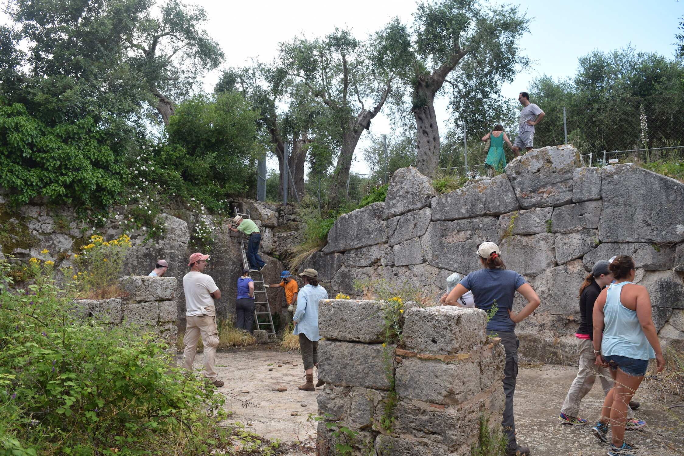 Excavators investigate the large, public reservoir which was used to supply water to the bath.&nbsp;