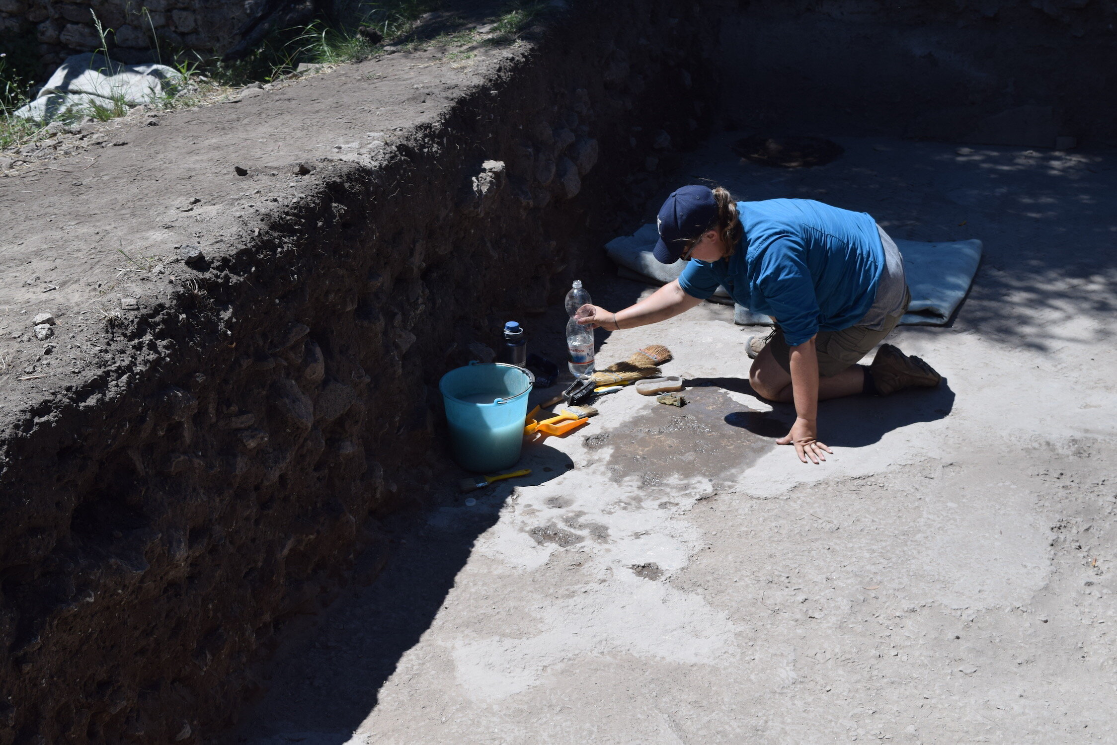 Liz Palazzolo cleans the floor of the frigidarium in order to see the tessellated cocciopesto floor of this room. 