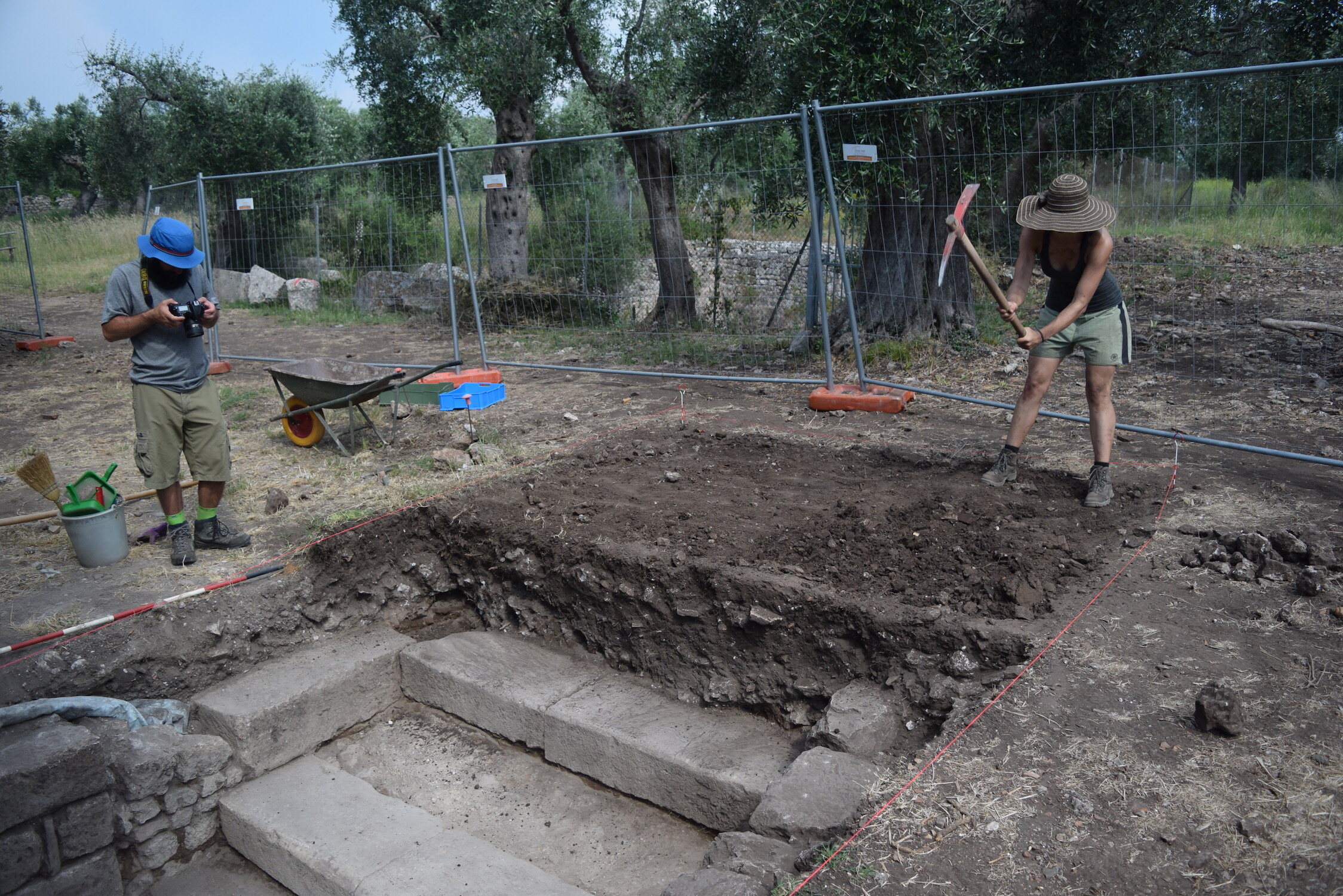 Matthew Brennan photographs while Rebecca Frank excavated the entrance to the bath complex. 