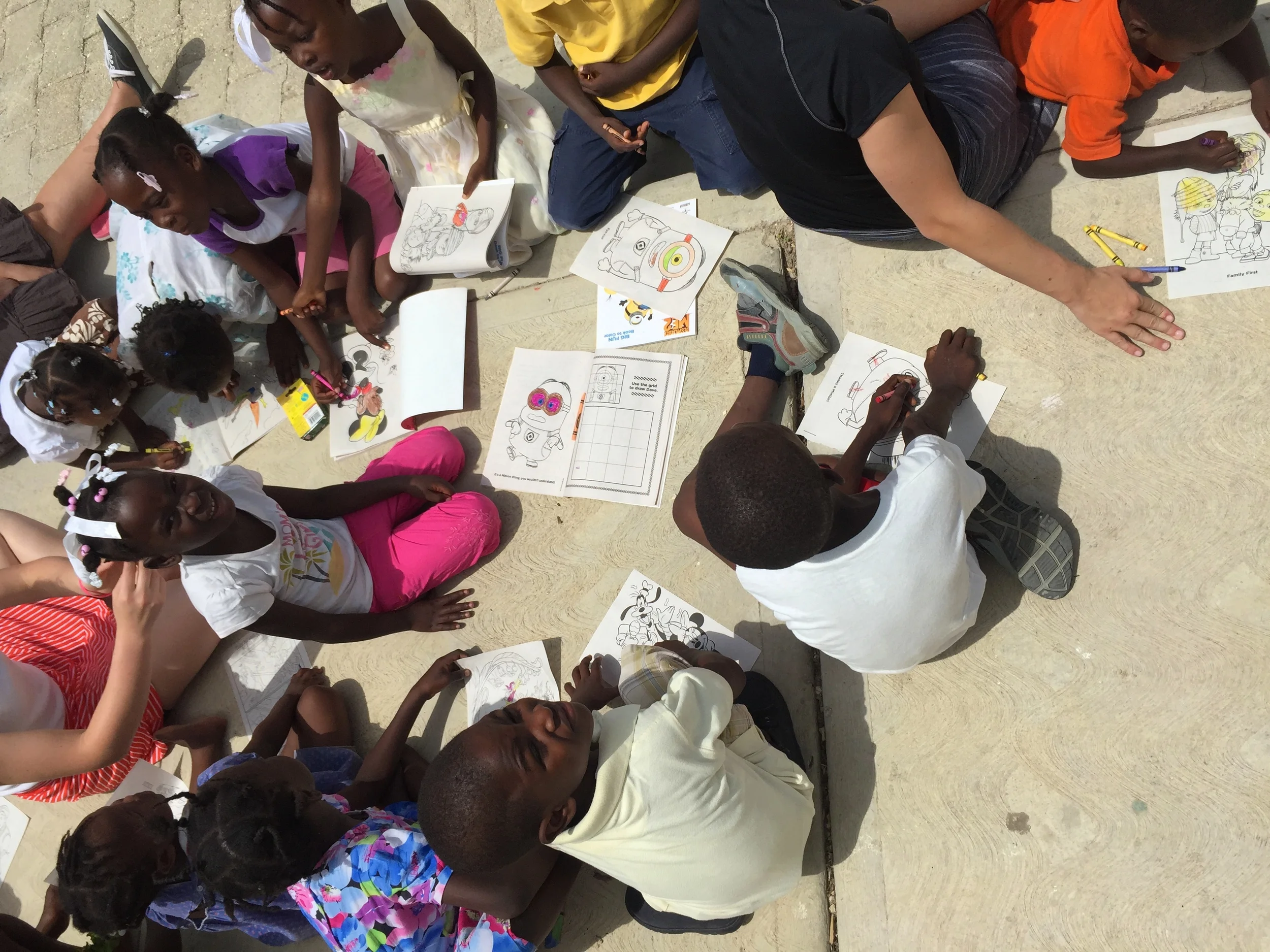 Coloring away in the hot sun.