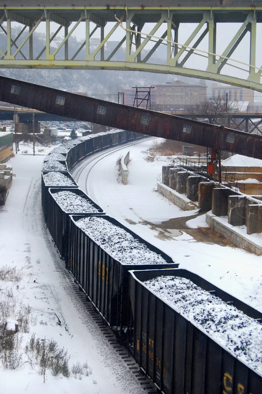 a freight train carrying coal through pittsburgh