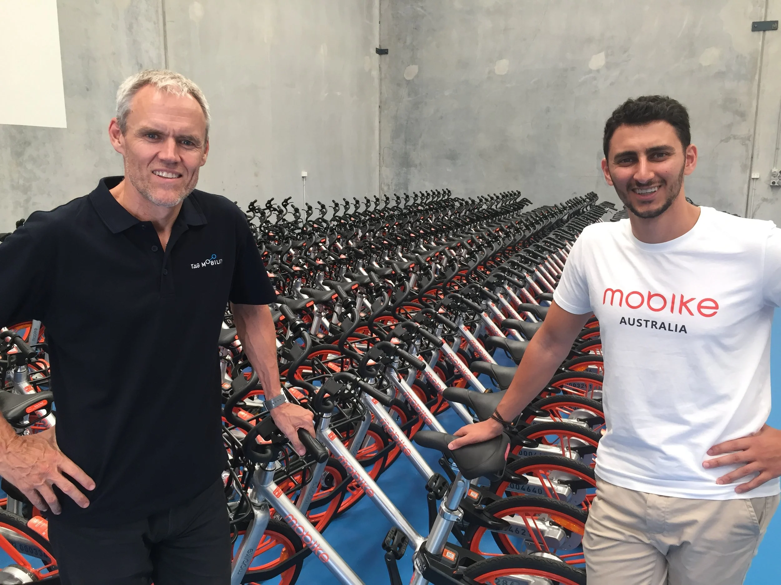 TAG Mobility GM Derek Mollison with Mobike Australia GM Mina Nada