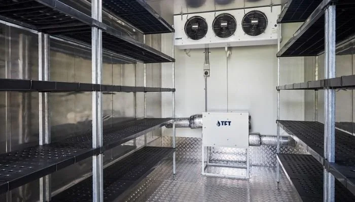 Seed storage room with shelving and industrial dehumidification system to maintain low humidity and preserve seed viability