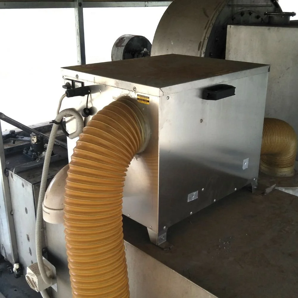 Commercial dehumidifier installed with surrounding ductwork, showing the need for adequate clearance for inspection and maintenance access.