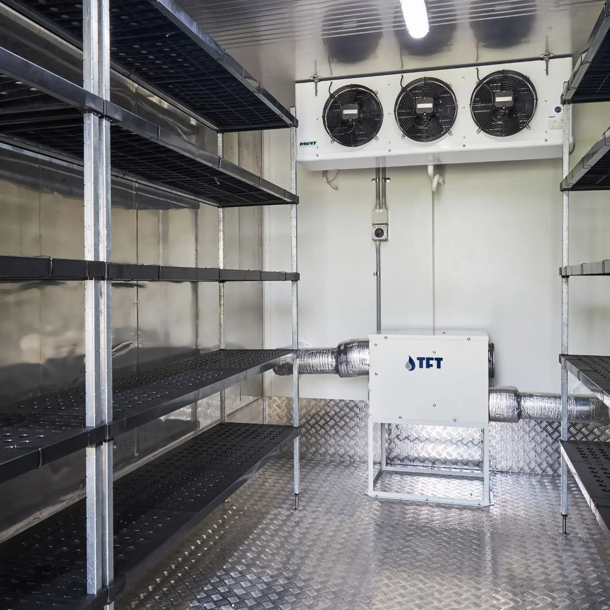 Dehumidifier installed directly inside a controlled storage room.