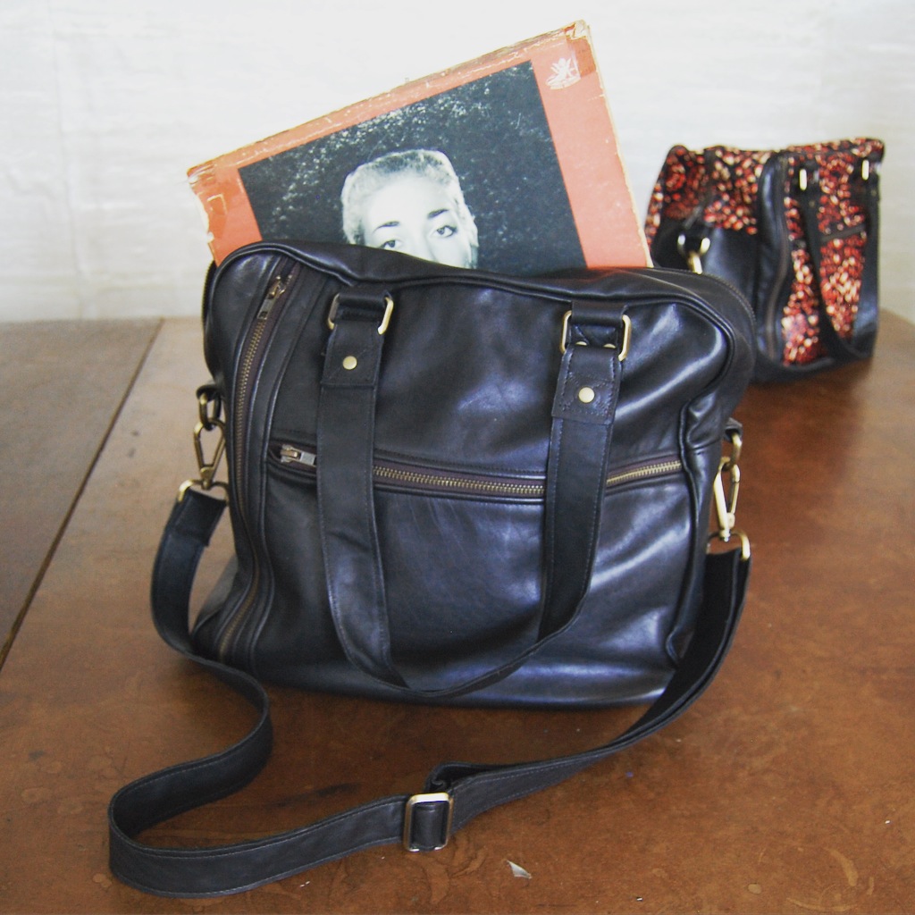 A Production Mode black leather bag.