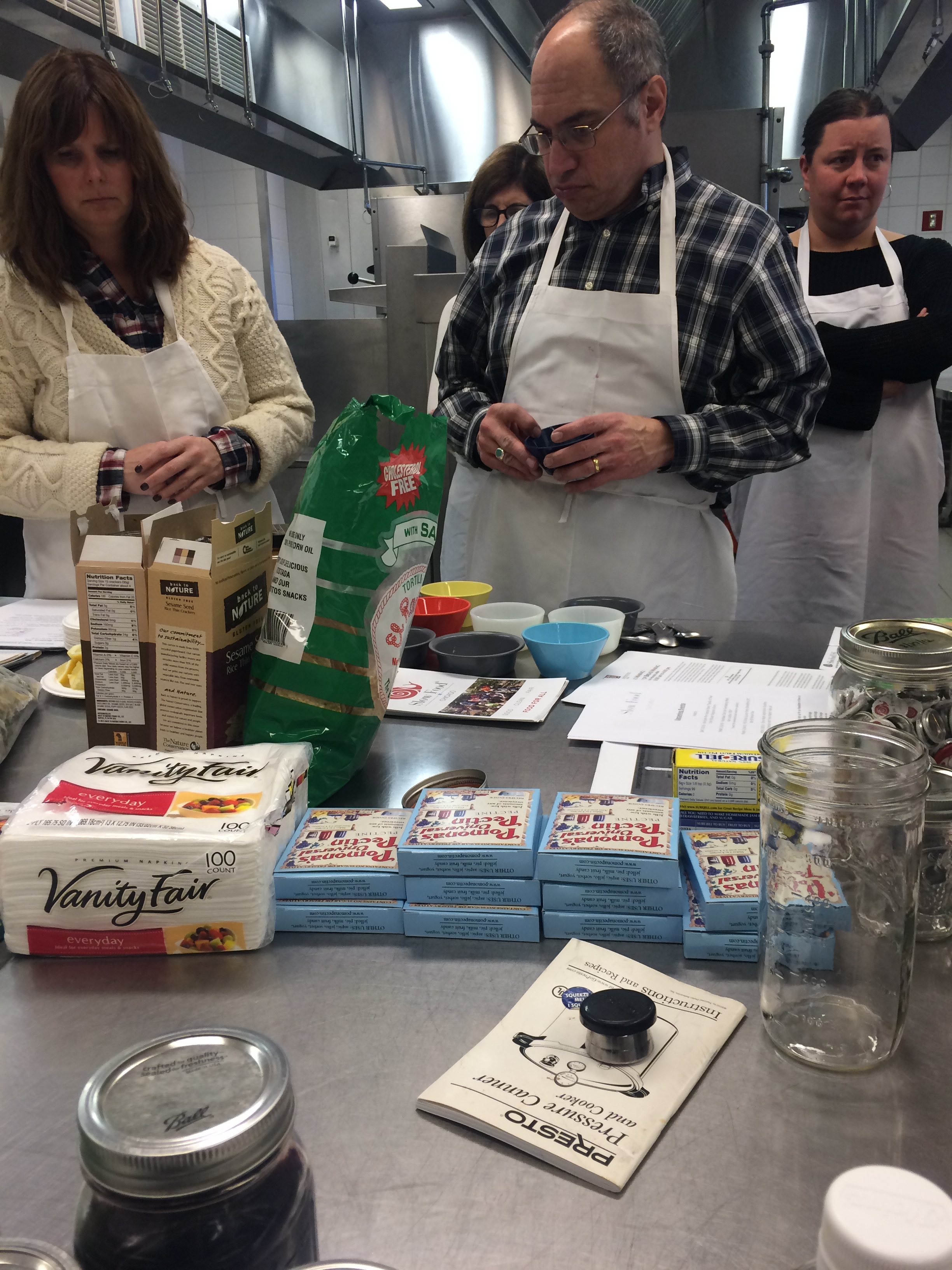  Attendees deciding which spices to flavor their preserves with. 