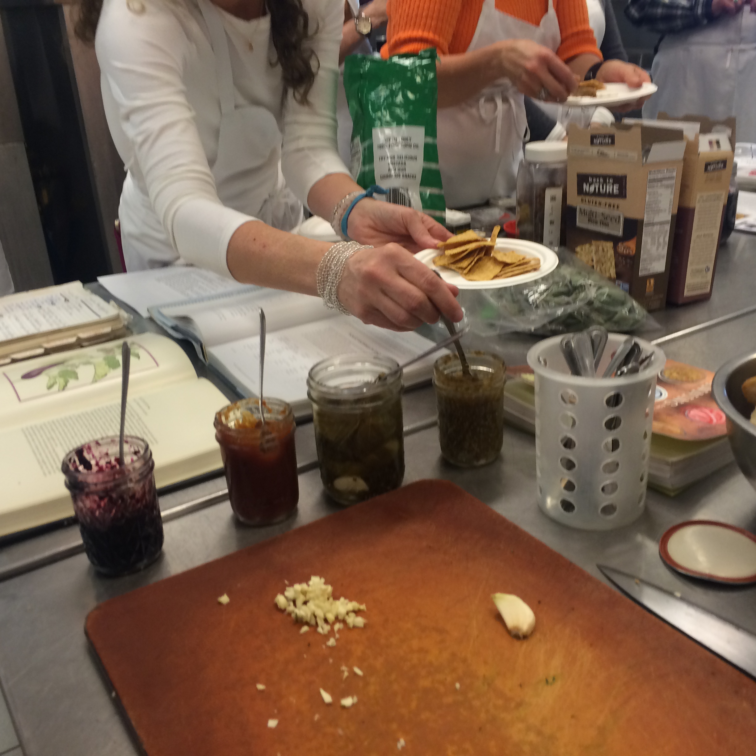  Participants sampling some of Kim's creations - blueberry preserves, tomato basil jam, dill pickles and salsa verde. 