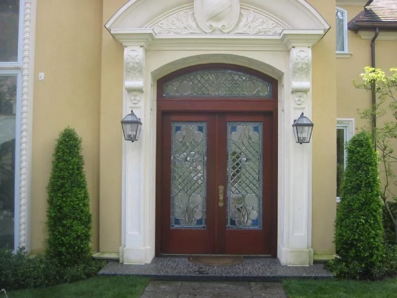 Intricate Beveled Front Doors and Arched Transom