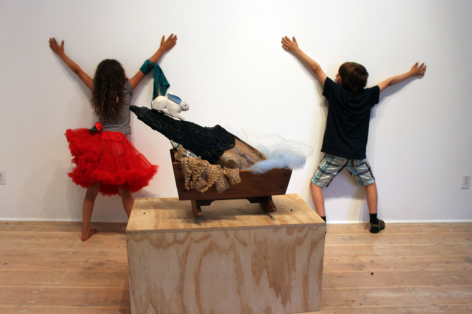 Finn is a jokster. Art making was not much his thing. Acting silly among the objects was his thing. Although he did manage to throw together this brilliant sculpture of burnt wood, baby blue crinoline and a wooden rabbit all balanced in a bab
