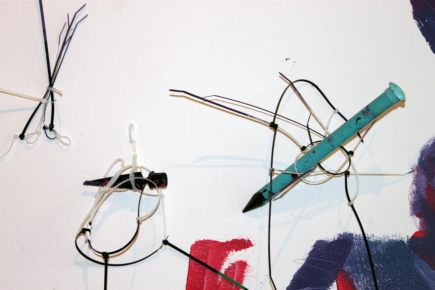 On day two he hammered his handmade paint applicators to the wall...