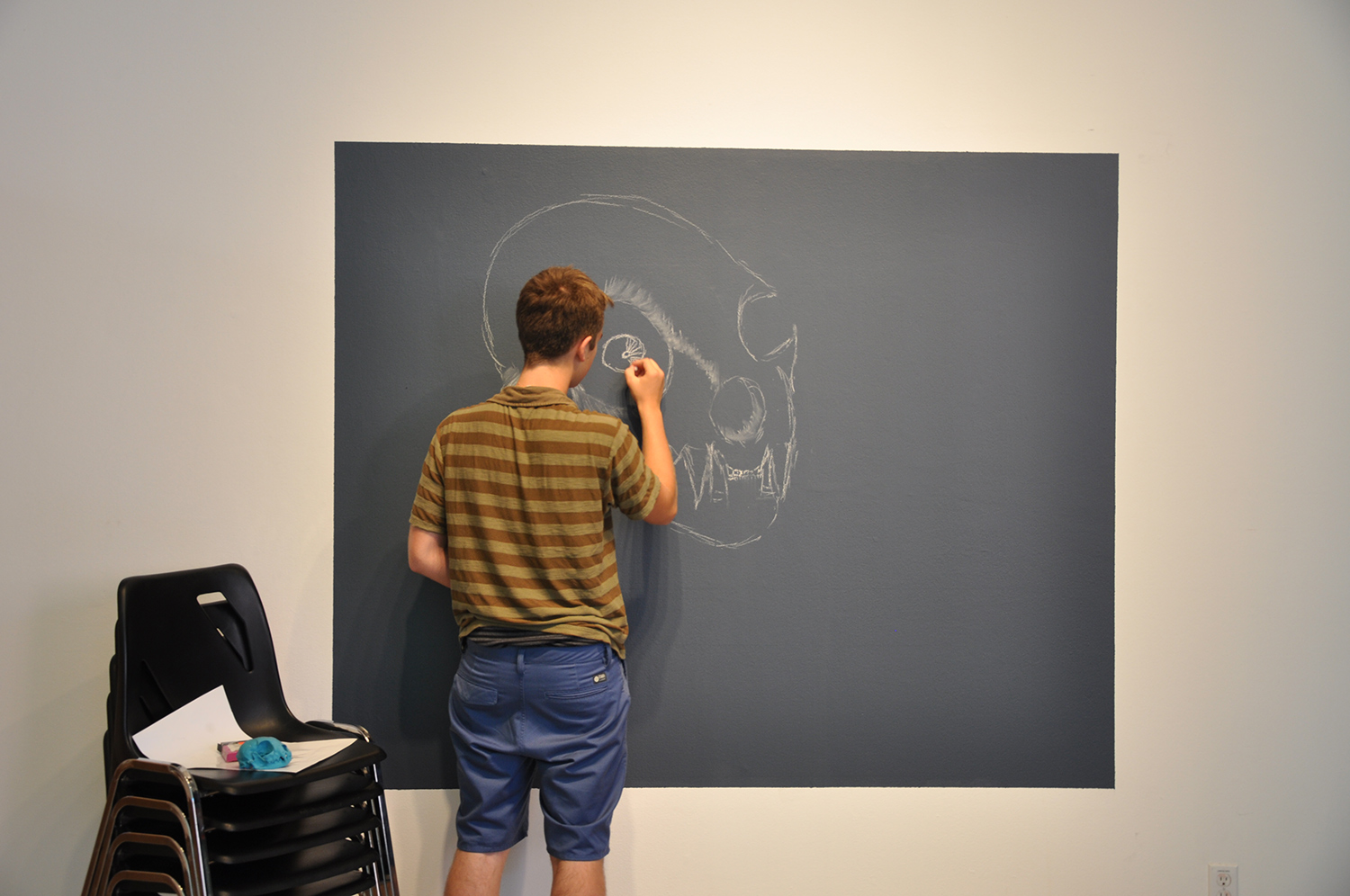 He drew the skull then continued to draw it back to life.