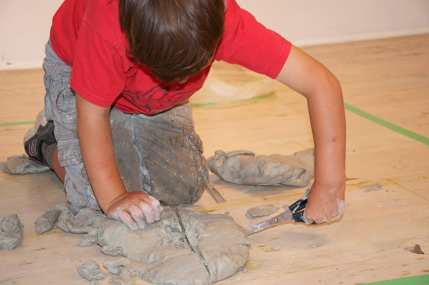 Octobers dad is a bread baker. So he attacked this block of clay like it was dough.