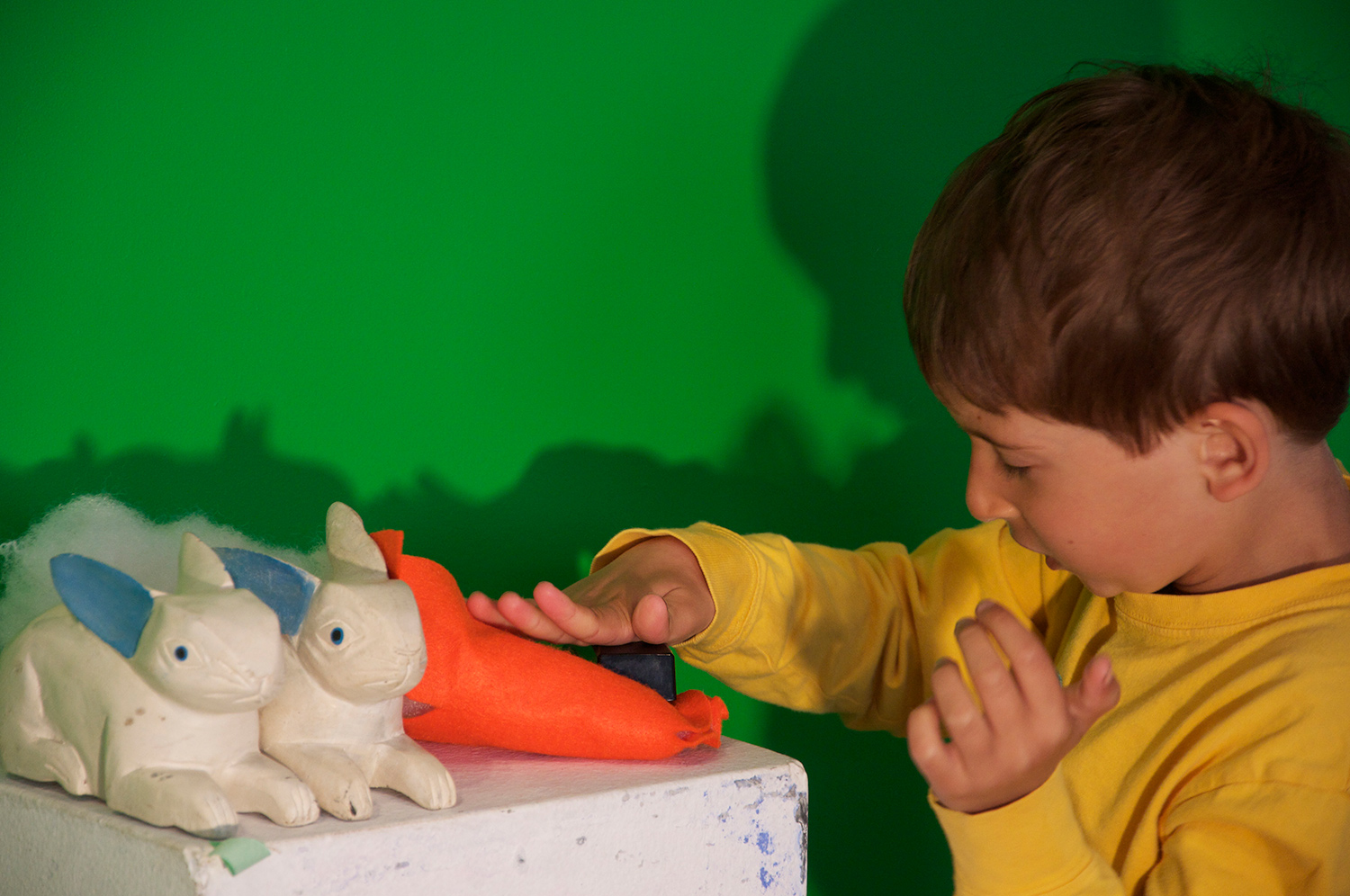 The task was simple for Asher. Make carrots for the two wooden rabbits using only fabric, stuffing and a stapler.