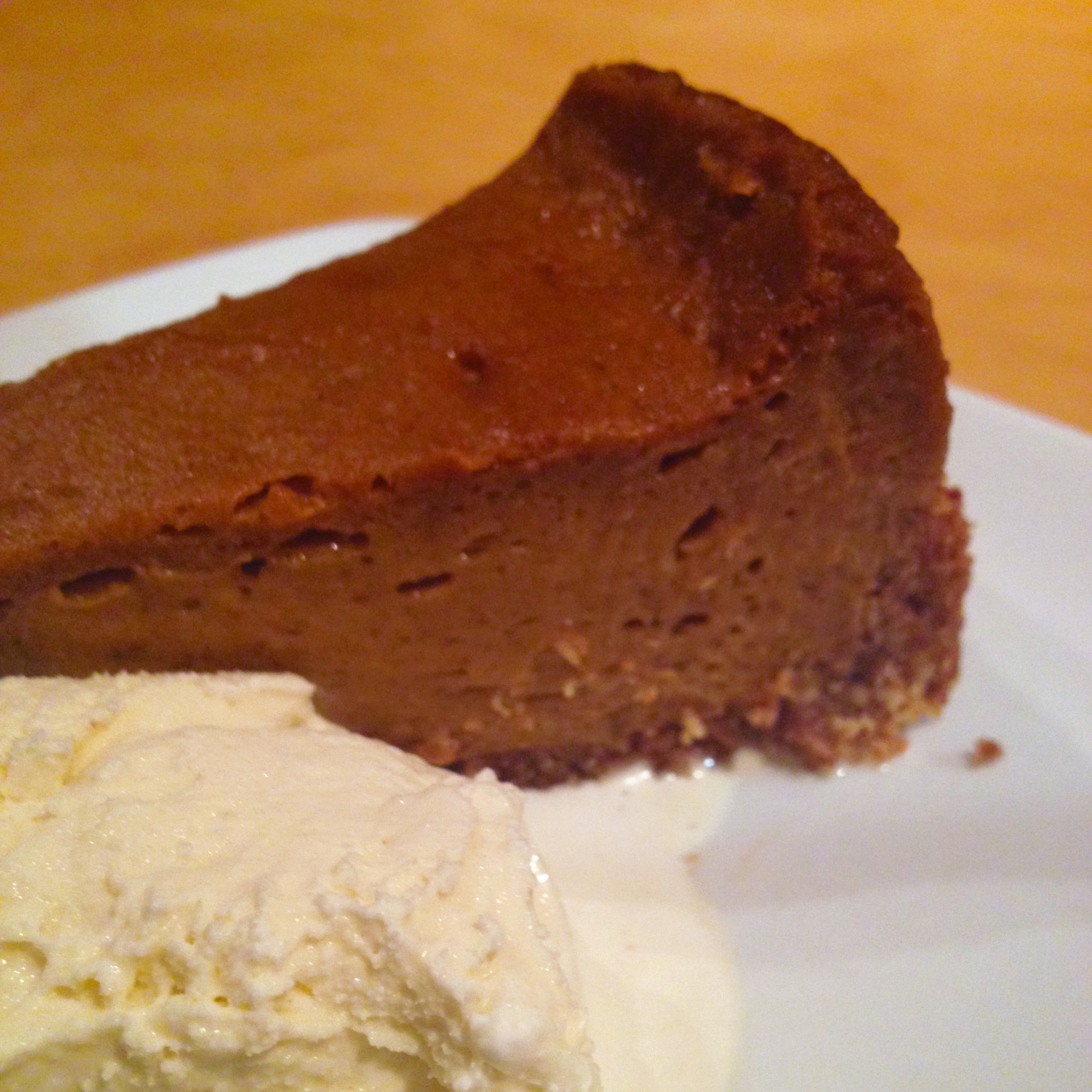vegan pumpkin pie with a coconut hazelnut crust cinnamon ice creamn