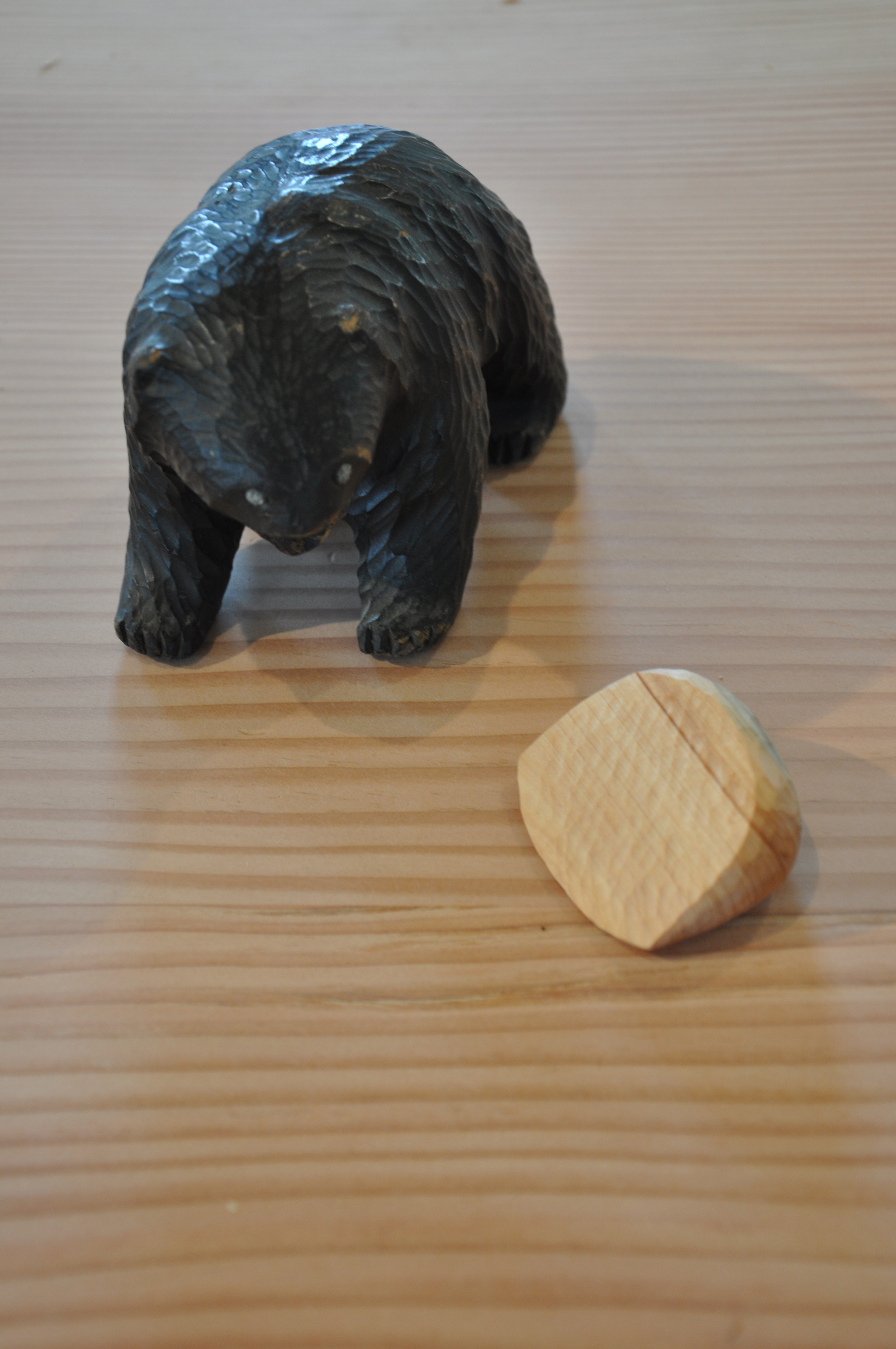  Whittling being evaluated by vintage Ainu bear sculpture 