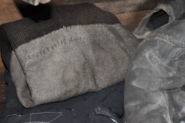 A jumper carefully mended with sail cloth.