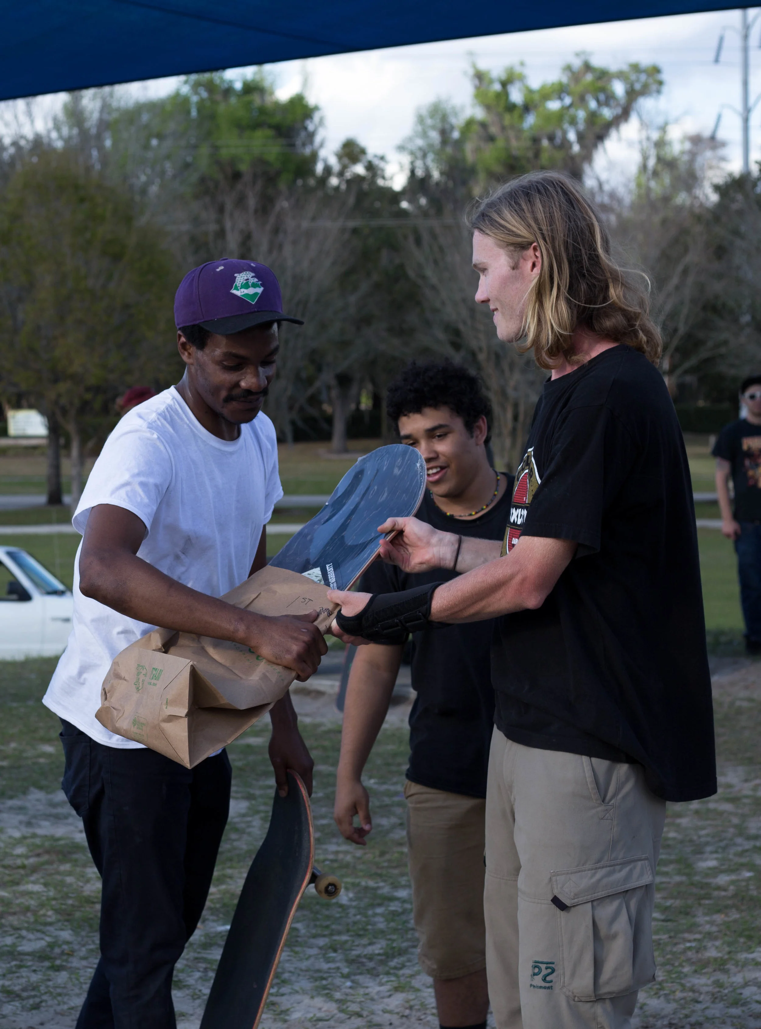 Dante DeBose get hooked up! Gator Skate Club member, Patrick Lynch, passes the product.