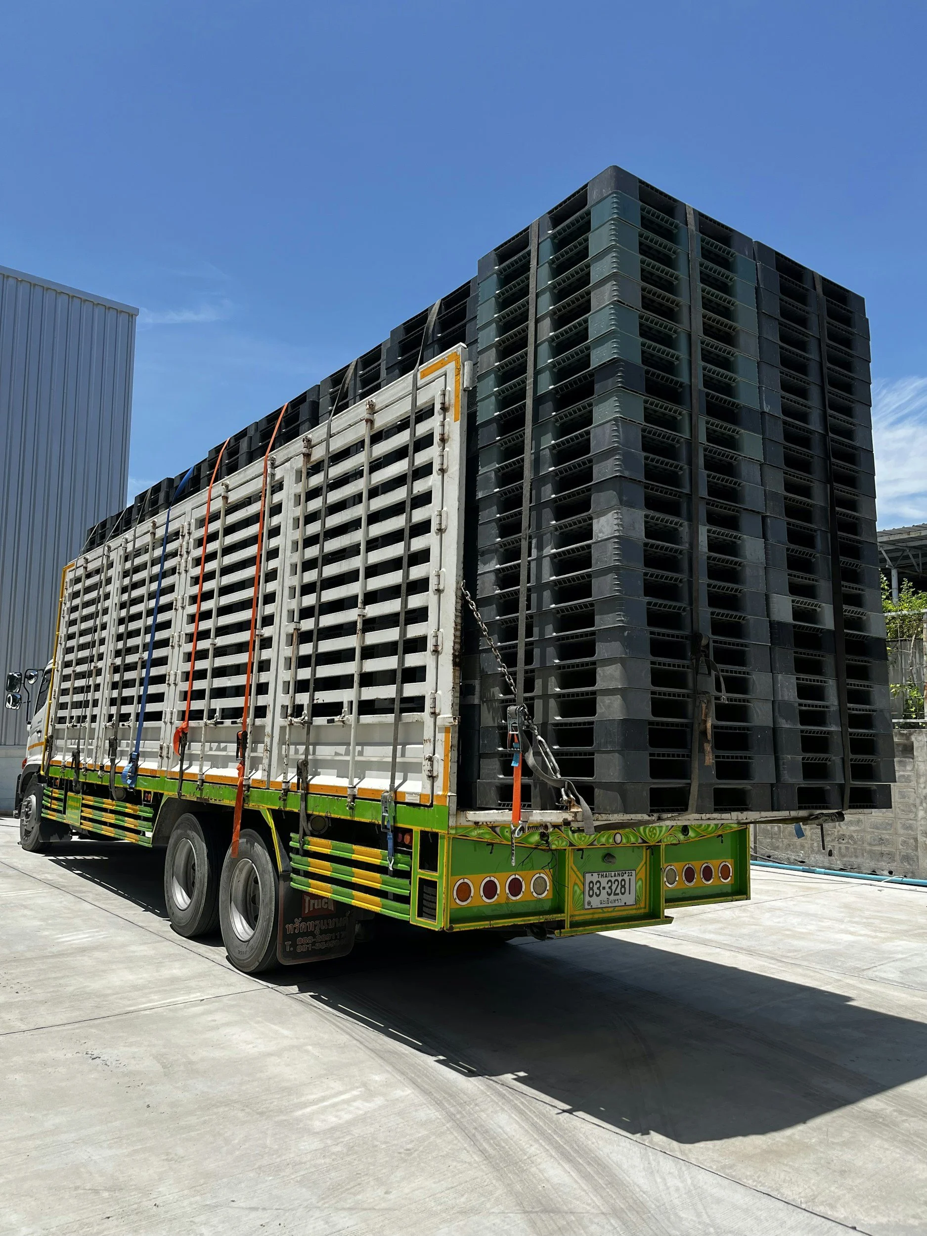 A large truck loaded with numerous pallets. Delivering and pick up to Rhode Island (RI) and surrounding areas.