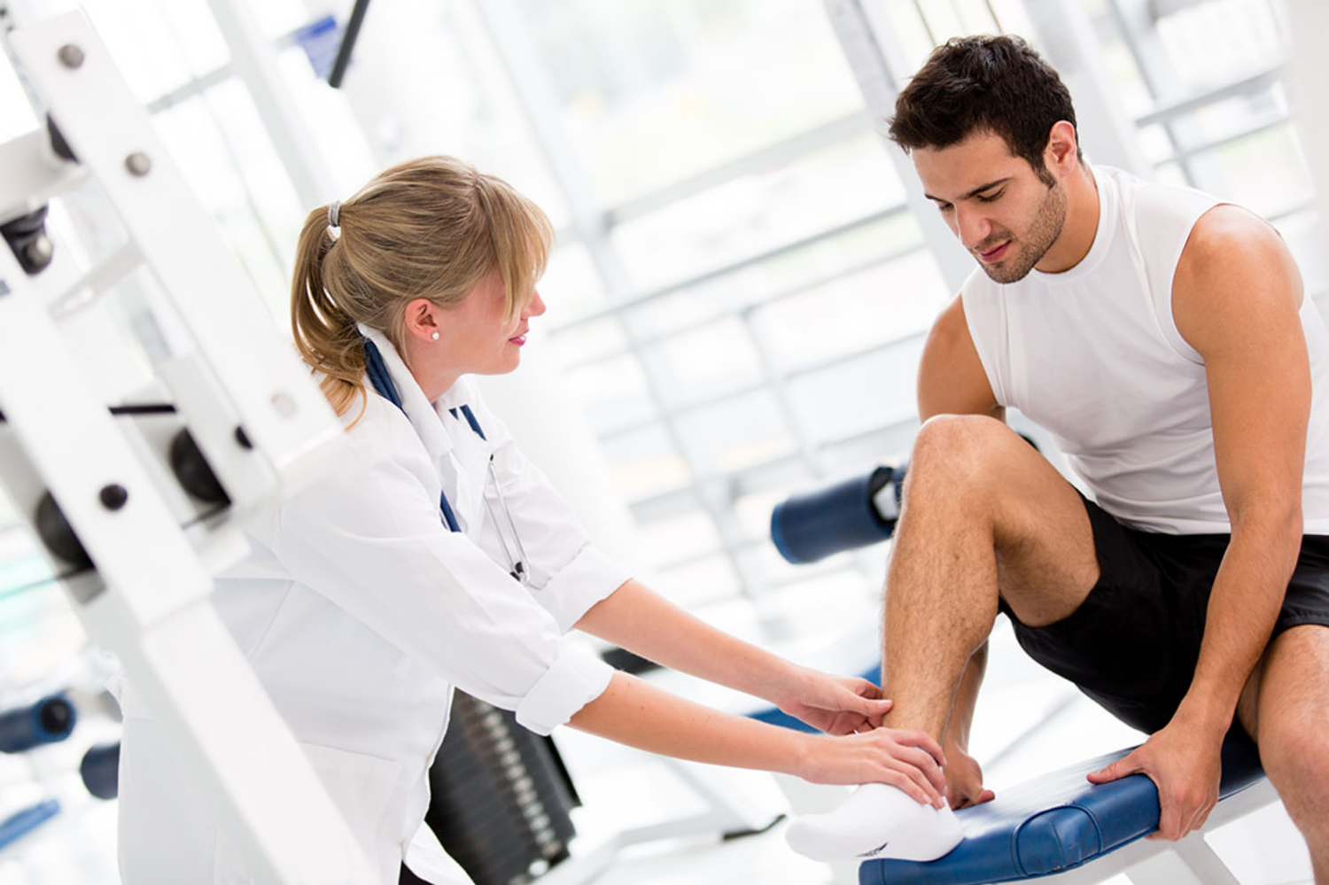 Male-getting-ankle-examined.jpg