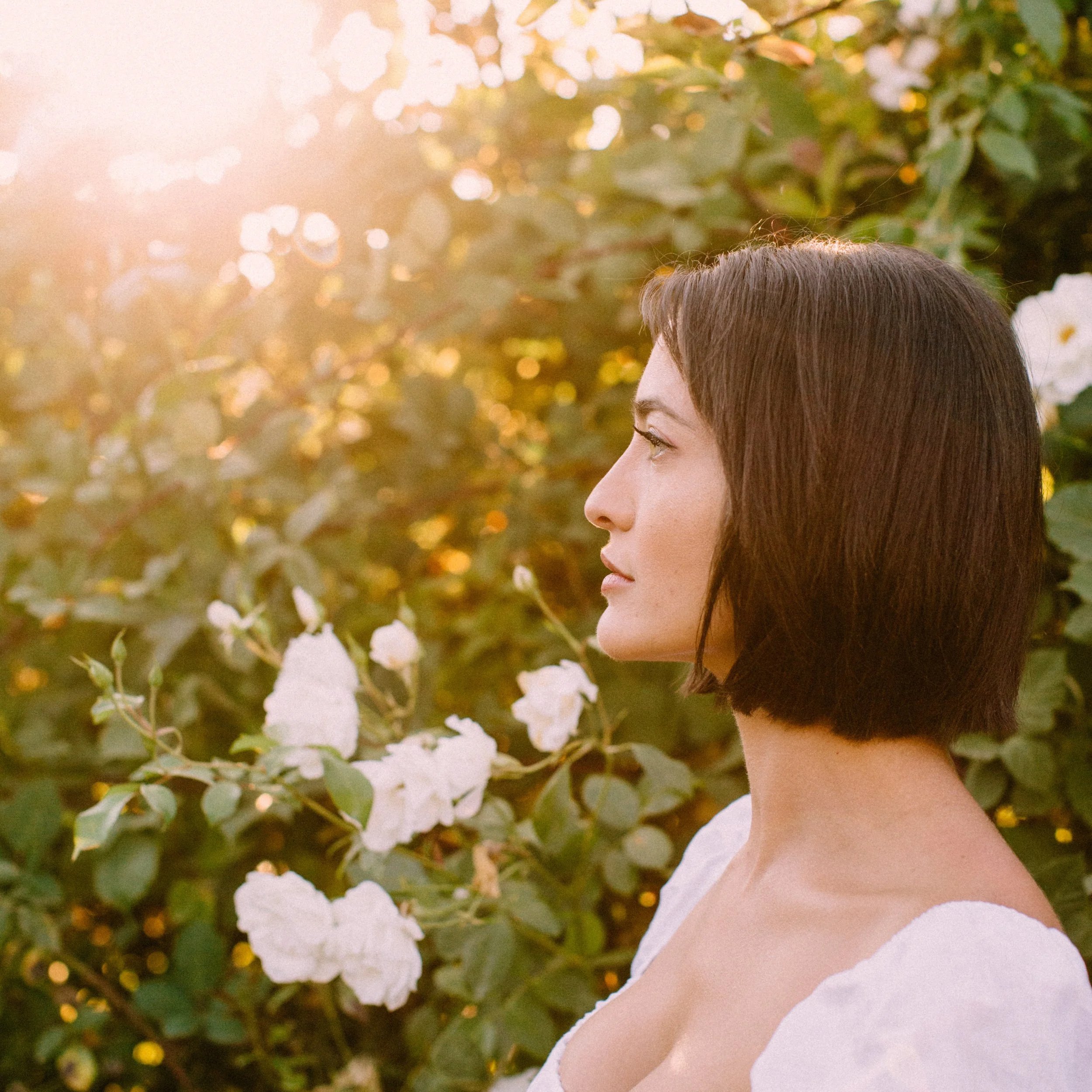 women in rose garden