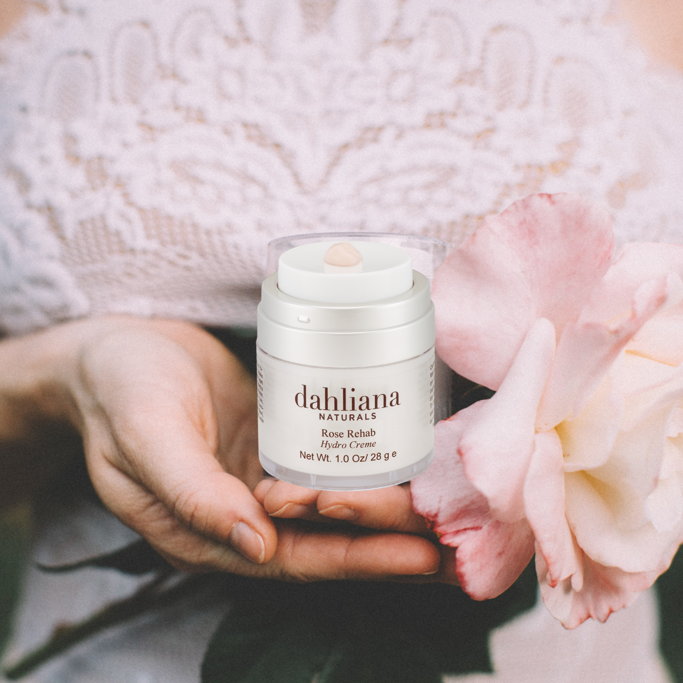 Dahliana+Rose+Cream+with+Hands+holding+the+cream+and+a+Rose+.png