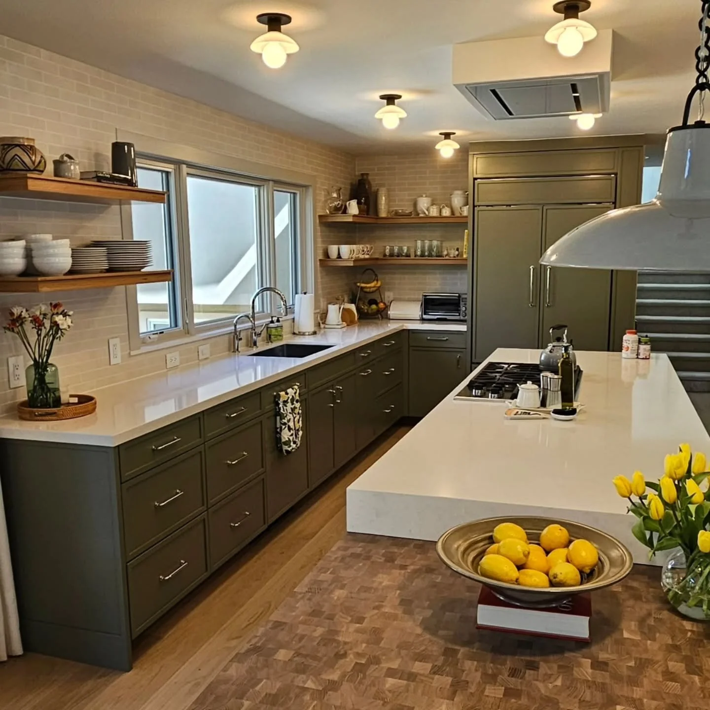 We finished up this project last year for SL Murphy Construction, designed by Emily Tucker Design.  Thin  shaker doors and drawers, finished in a tinted conversion varnish that were colored  matched.  Rift sawn white oak floating shelves.